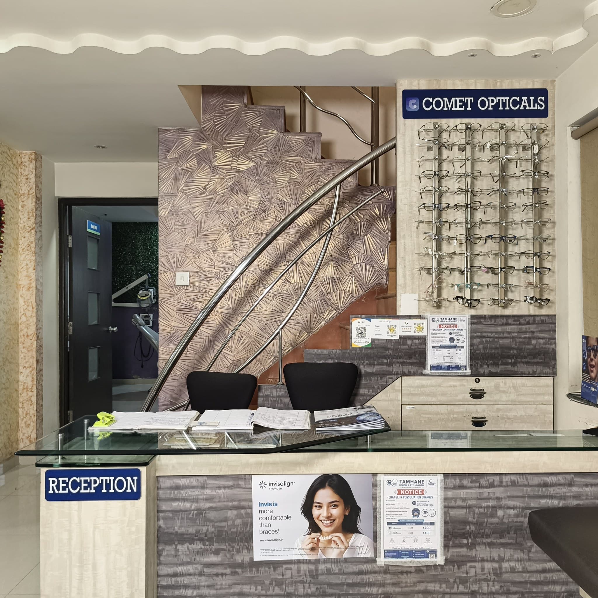 Hospital reception desk and Comet Opticals prescription eyewear counter